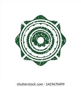 Green donut icon inside rubber grunge seal