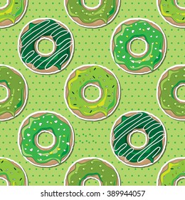 Green donuts, decorated for St Patrick's Day, over a green polka dot seamless background. EPS10 vector format