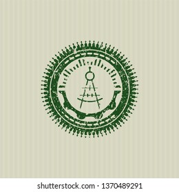 Green drawing compass icon inside distress rubber stamp