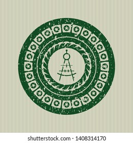 Green drawing compass icon inside distressed grunge style stamp