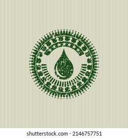 Icono de gota verde dentro de la estampilla de grunge de socorro. 