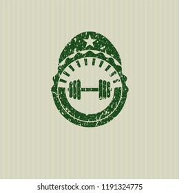 Green dumbbell icon inside rubber seal