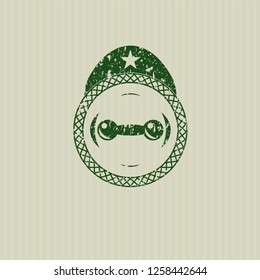 Green dumbbell icon inside rubber grunge stamp