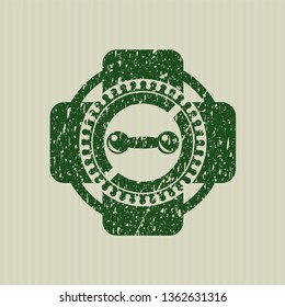 Green dumbbell icon inside rubber grunge texture seal