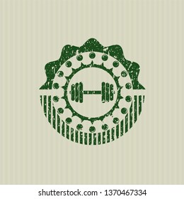 Green dumbbell icon inside rubber grunge stamp