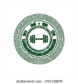 Green dumbbell icon inside rubber stamp with grunge texture