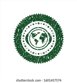 Green earth icon inside distressed rubber stamp with grunge texture