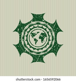 Green earth icon inside distressed rubber stamp
