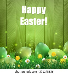 Green Easter eggs with a green wooden background.