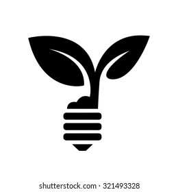 green eco energy concept, plant growing inside light bulb