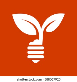 green eco energy concept, plant growing inside the light bulb