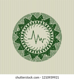 Green electrocardiogram icon inside grunge stamp