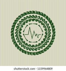 Green electrocardiogram icon inside rubber seal
