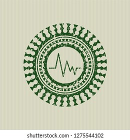 Green electrocardiogram icon inside rubber seal with grunge texture