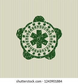 Green emergency cross icon with rubber seal texture