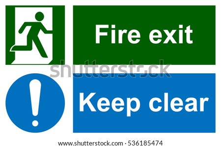 Green emergency exit sign on white