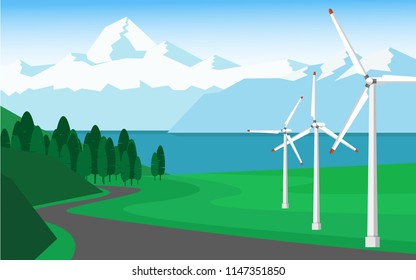 Green energy concept - Landscape view of wind power turbine with clear blue sky and snow mountain range in background and copy space for text