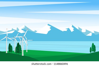 Green energy concept - Landscape view of wind power turbine with clear blue sky and snow mountain range in background and copy space for text