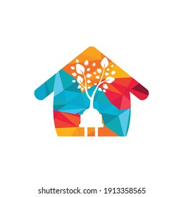 Green energy electricity logo concept. Electric plug icon with tree and home.	
