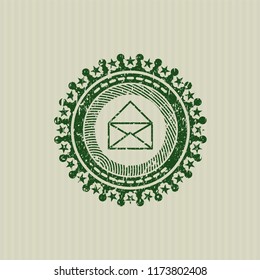 Green envelope icon inside distress rubber seal with grunge texture
