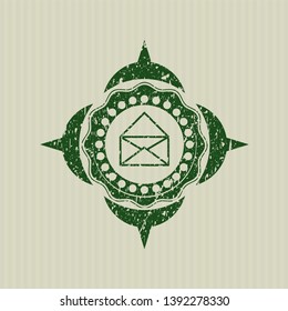 Green envelope icon inside distress with rubber seal texture