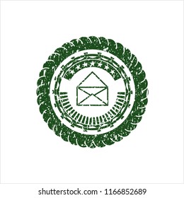 Green envelope icon inside distressed rubber stamp