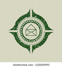 Green envelope icon inside distressed grunge style stamp