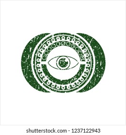 Green eye icon inside distressed grunge seal
