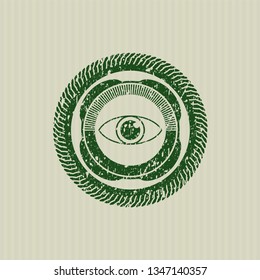 Green eye icon inside distressed rubber stamp