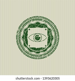 Green eye icon inside grunge style stamp