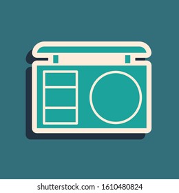 Green Eye shadow palette with brush icon isolated on blue background. Long shadow style. Vector Illustration