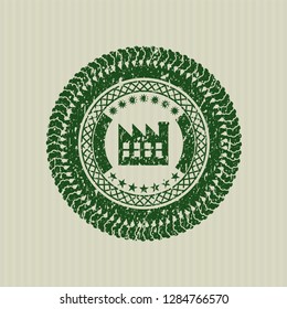 Green factory icon inside distressed rubber seal