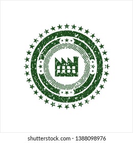 Green factory icon inside distressed rubber grunge texture stamp