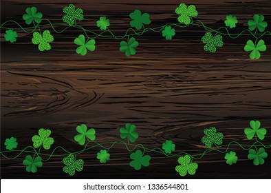 Green festive bunting with clover. Irish holiday - Happy St. Patrick's Day with garland of three-leaf. Greeting card, poster, banner. Vector on wooden background