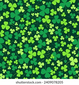 A green field of shamrocks of different colors. Seamless vector pattern. St. Patrick's Day. Lucky clover. Amazing natural background.