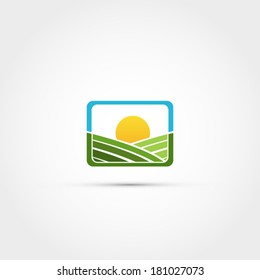 Green field with sun icon