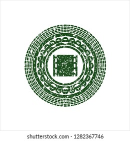 Green film icon inside distress rubber seal