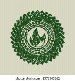 Green fire icon inside distress grunge style stamp