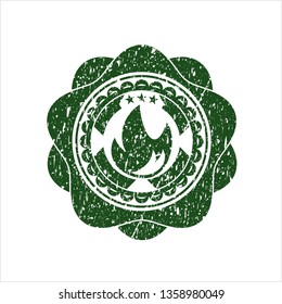 Green fire icon inside distressed grunge seal