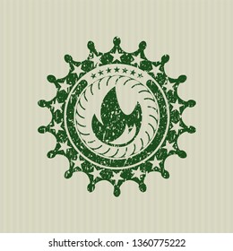Green fire icon inside rubber stamp
