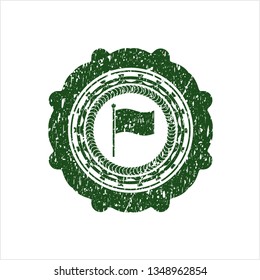 Green flag icon inside distressed rubber grunge stamp
