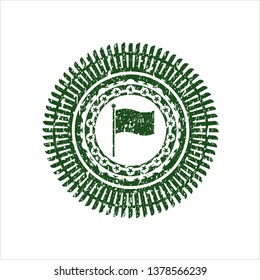 Green flag icon inside rubber seal with grunge texture