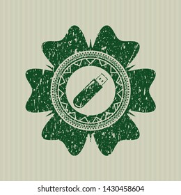 Green flash drive icon inside rubber stamp with grunge texture