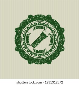 Green flashlight icon inside rubber seal with grunge texture