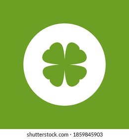 Green flat icon of irish clover in circle. Shamrock isolated on green background. Vector illustration. Eco style. St Patrick day badge