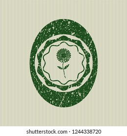 Green flower icon inside distressed grunge seal