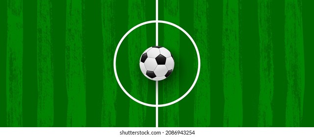 Green football field made of brush stroke with realistic soccer ball. Vector banner template for sport tournaments and competitions