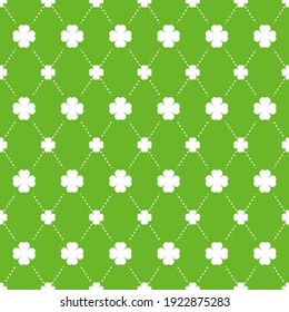 Green four clover leaf seamless pattern vector illustration. Shamrock with argyle dots on green background.
