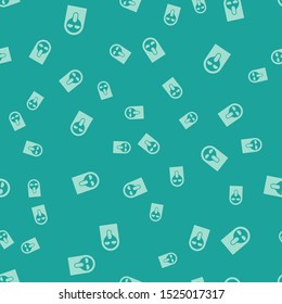 Green Funny and scary ghost mask for Halloween icon isolated seamless pattern on green background. Happy Halloween party.  Vector Illustration