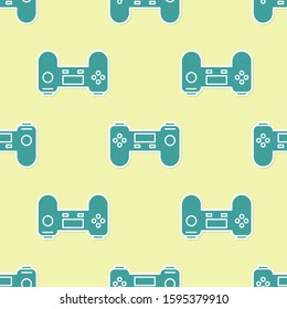 Green Gamepad icon isolated seamless pattern on yellow background. Game controller.  Vector Illustration